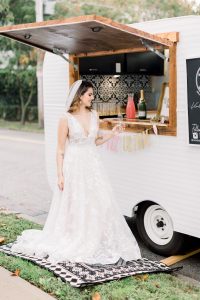 woman in wedding dress in front of mobile bar at get fabulous event