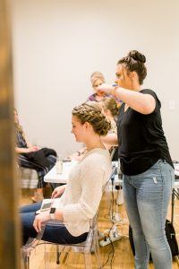 woman getting hair updo at get fabulous event