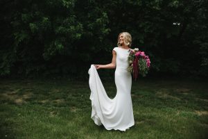 woman in simple wedding dress at spring wedding