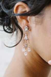 woman in rose gold earring