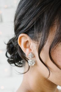 woman in silver metal earring