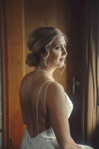 bride in fitted lace wedding dress