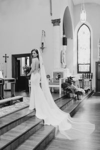 real bride jordan at church in dress and veil