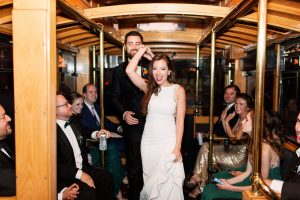 bride and groom on party bus with bridal party
