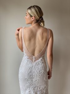 glam bride in fitted beaded gown and low back