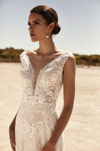 zavana bridal - fitted beaded dress with plunging neckline